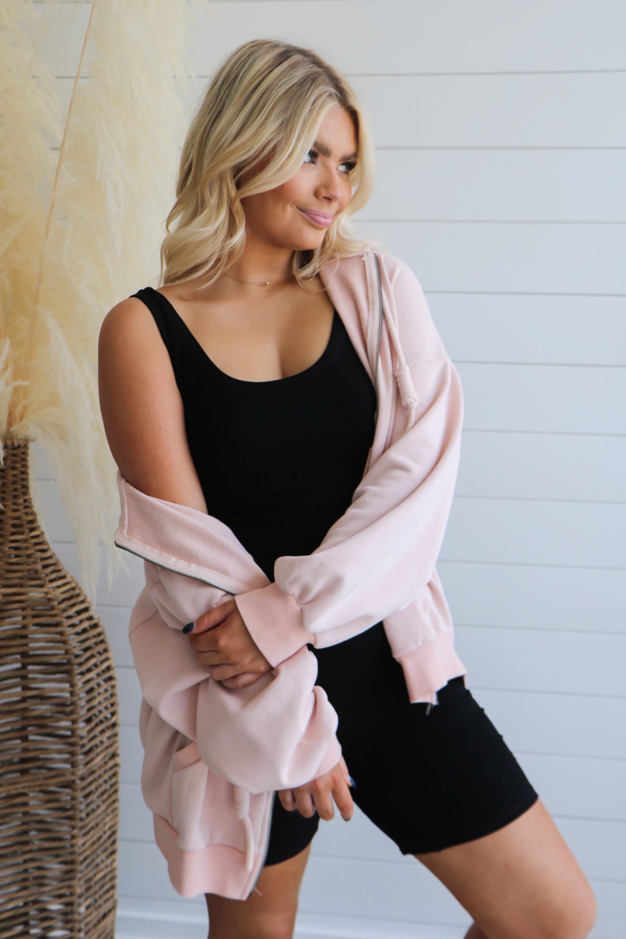 Taking Off Jacket in Blush